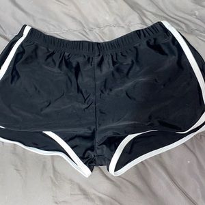 Black swim shorts with white stripe